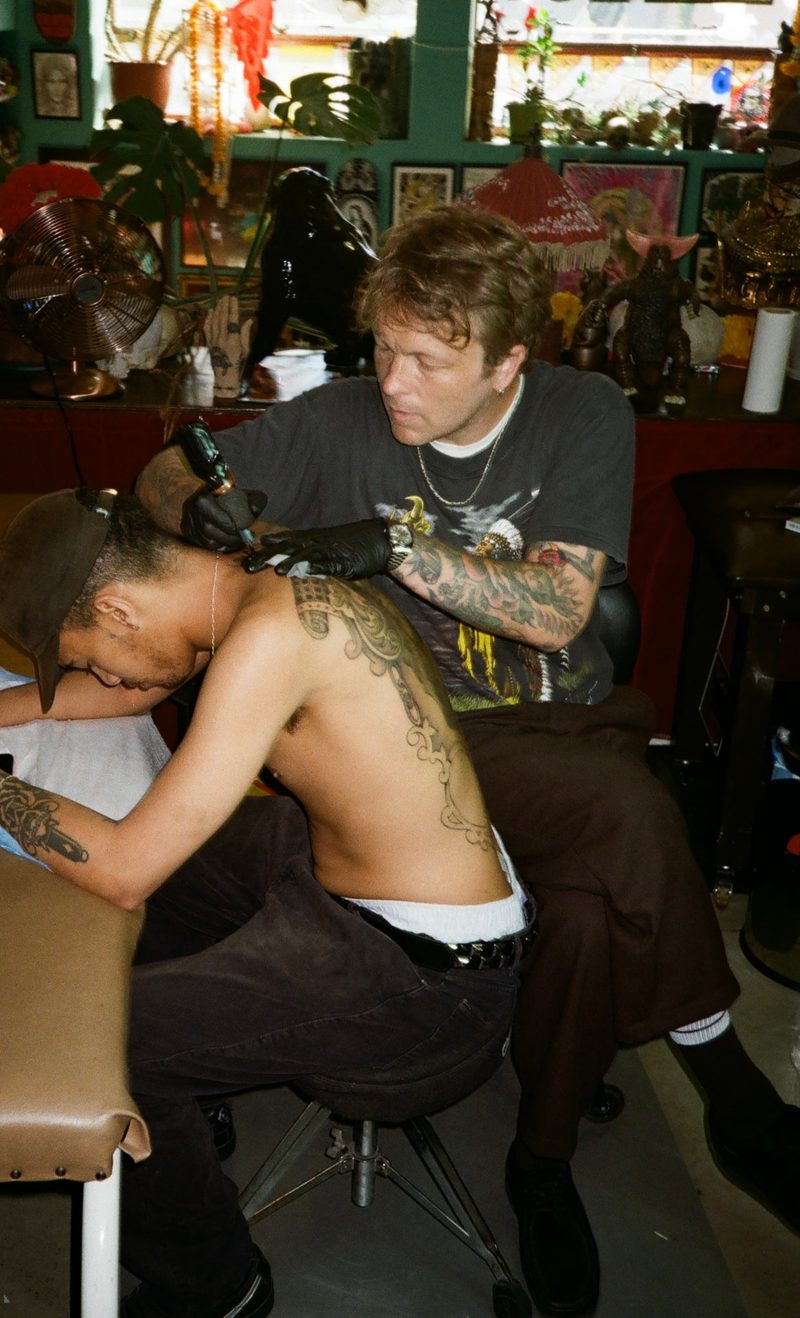 Bruce the Kid tattooing a client at TOMB Tattoo, Cape Town