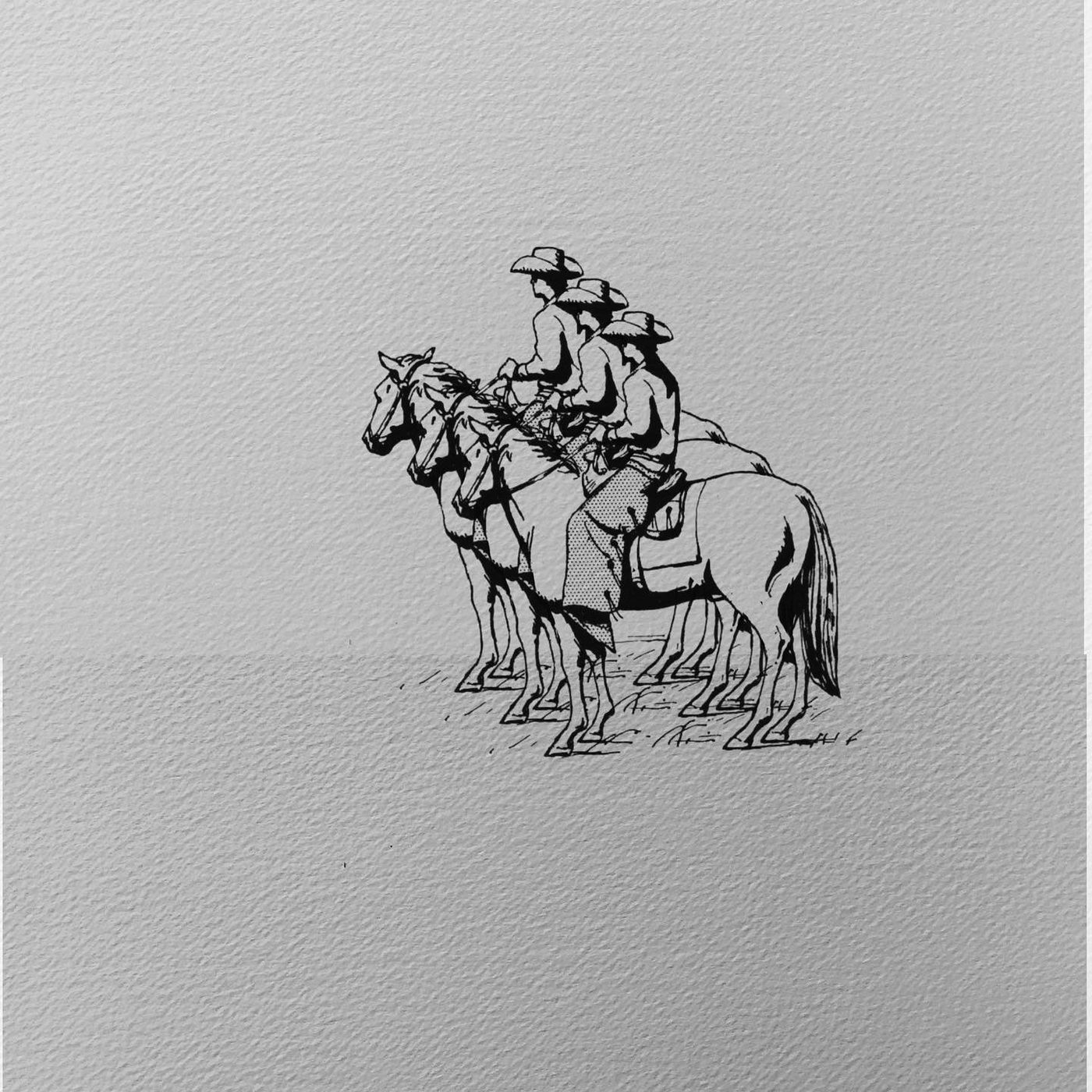 Three cowboys sitting on horseback